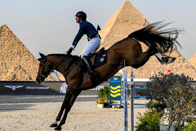 England's Ben Maher competes during the Longines Global Champions Tour 2026 at the Giza pyramids, west of Cairo on October 24, 2026. (Photo by Khaled DESOUKI / AFP)
