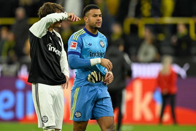 Frankfurt's German defender #04 Robin Koch and Frankfurt's German goalkeeper #01 Noah Atubolu are pictured after the German first division Bundesliga football match between BVB Borussia Dortmund and Eintracht Frankfurt in Dortmund, western Germany on October 24, 2026. (Photo by INA FASSBENDER / AFP) / DFL REGULATIONS PROHIBIT ANY USE OF PHOTOGRAPHS AS IMAGE SEQUENCES AND/OR QUASI-VIDEO
