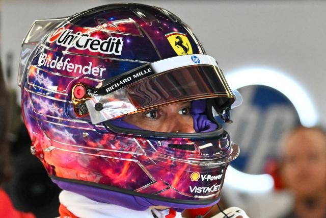Ferrari's British driver Lewis Hamilton looks on in the garage during the final practice session for the United States Formula One Grand Prix at the Circuit of the Americas in Austin, Texas, on October 24, 2026. (Photo by ANGELA WEISS / AFP)