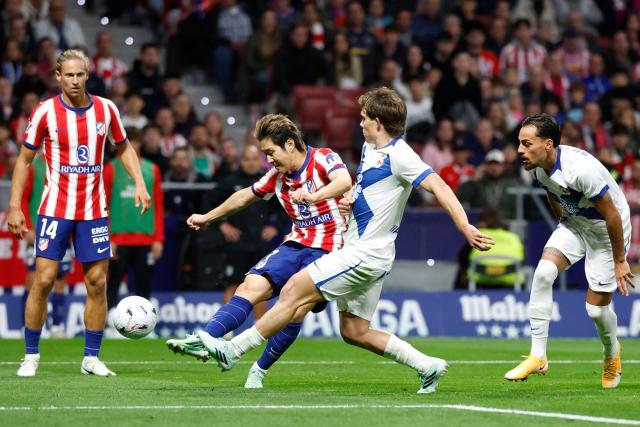 Atletico Madrid's South Korean midfielder #07 Kang-In Lee (2L) is challenged by Deportivo La Coruna's Italian midfielder #16 Lorenzo Amatucci (2R) during the Spanish league football match between Club Atletico de Madrid and RC Deportivo de la Coruna at Metropolitano Stadium in Madrid on October 24, 2026. (Photo by Oscar DEL POZO / AFP)