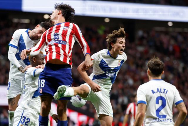 (From L) Deportivo La Coruna's Uruguayan defender #20 Jose Gimenez, Deportivo La Coruna's Cameroonian forward #32 Bill Nsongo, Atletico Madrid's Spanish defender #18 Marc Pubill and Deportivo La Coruna's Italian midfielder #16 Lorenzo Amatucci vie for a header during the Spanish league football match between Club Atletico de Madrid and RC Deportivo de la Coruna at Metropolitano Stadium in Madrid on October 24, 2026. (Photo by Oscar DEL POZO / AFP)