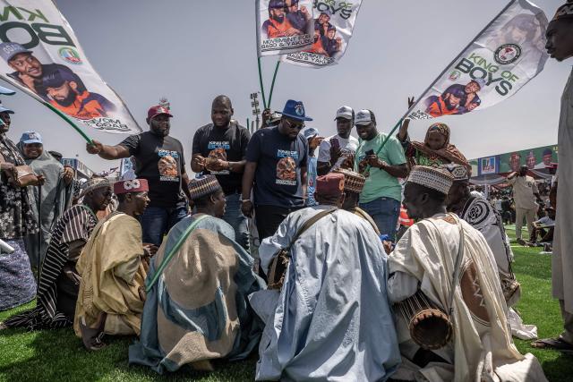Supporters of the All Progressives Congress (APC) are seen singing and dancing during the presidential campaign flag-off rally at the Ranchers Bees stadium in Kaduna, on October 24, 2026. Nigerian President Bola Tinubu launches his re-election campaign on Saturday facing voter anger over insecurity and economic hardships. (Photo by Light Oriye Tamunotonye / AFP)