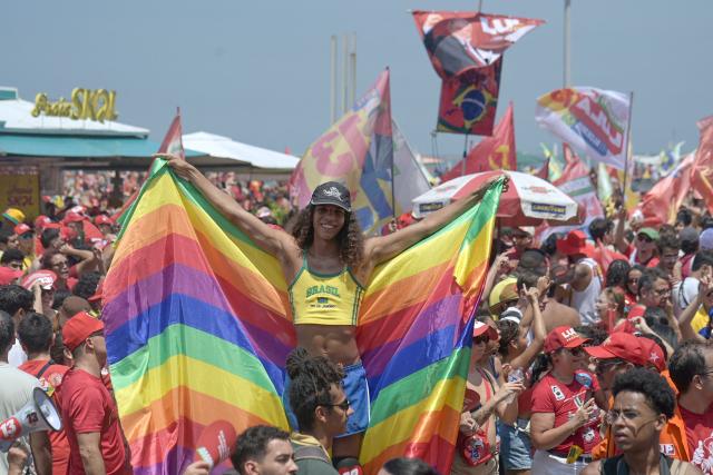 Supporters of Brazil's President and presidential candidate Luiz Inacio Lula da Silva attend a campaign rally at Copacabana beach in Rio de Janeiro, Brazil on October 24, 2026, ahead of the presidential election runoff. (Photo by TERCIO TEIXEIRA / AFP)