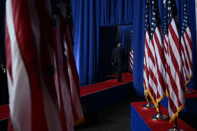 US President Donald Trump walks off stage after speaking at a midterm election campaign rally at Guardian Centers of Georgia in Perry, Georgia on October 24, 2026. President Trump is traveling around the country to try to give a boost to Republicans in tight midterm races. (Photo by Brendan SMIALOWSKI / AFP)