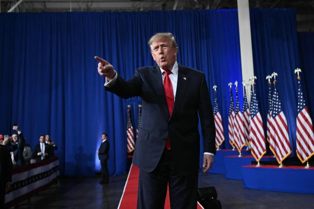US President Donald Trump points as he walks on stage at a midterm election campaign rally at Guardian Centers of Georgia in Perry, Georgia on October 24, 2026. President Trump is traveling around the country to try to give a boost to Republicans in tight midterm races. (Photo by Brendan SMIALOWSKI / AFP)