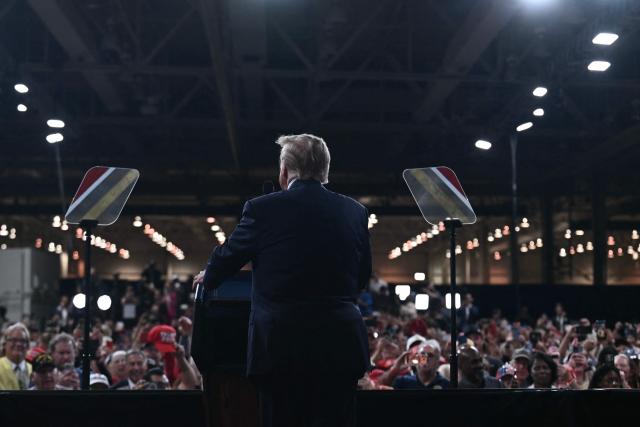 US President Donald Trump speaks at a midterm election campaign rally at Guardian Centers of Georgia in Perry, Georgia on October 24, 2026. President Trump is traveling around the country to try to give a boost to Republicans in tight midterm races. (Photo by Brendan SMIALOWSKI / AFP)