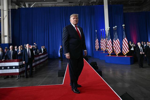 US President Donald Trump walks on stage at a midterm election campaign rally at Guardian Centers of Georgia in Perry, Georgia on October 24, 2026. President Trump is traveling around the country to try to give a boost to Republicans in tight midterm races. (Photo by Brendan SMIALOWSKI / AFP)