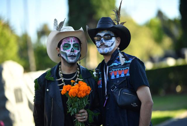 People in costume attend Hollywood Forever Cemetery's 27th annual Dia De Los Muertos event on October 24, 2026. (Photo by Chris DELMAS / AFP)