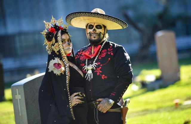 People in costume attend Hollywood Forever Cemetery's 27th annual Dia De Los Muertos event on October 24, 2026. (Photo by Chris DELMAS / AFP)