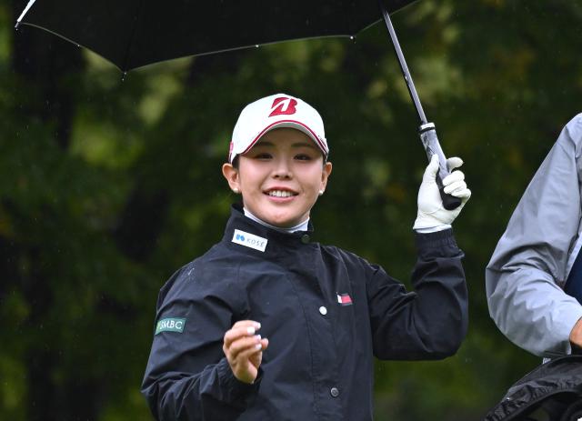 Yuri Yoshida of Japan smiles after teeing off on the 2nd hole during the final round of the LPGA Tour - BMW Ladies Championship golf tournament at Pine Beach Golf Links in Haenam on October 25, 2026. (Photo by Jung Yeon-je / AFP)