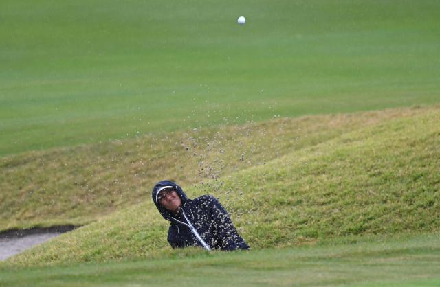 Aditi Ashok of India plays a bunker shot on the 5th hole during the final round of the LPGA Tour - BMW Ladies Championship golf tournament at Pine Beach Golf Links in Haenam on October 25, 2026. (Photo by Jung Yeon-je / AFP)