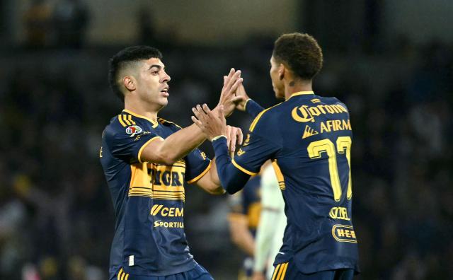 Tigres' Argentine midfielder #11 Juan Brunetta celebrates after scoring the equalising goal with teammate Tigres' forward #77 Ozziel Herrera  during the Liga MX Apertura tournament football match between Pumas and Tigres at the Olimpico Universitario stadium in Mexico City on October 24, 2026. (Photo by Yuri CORTEZ / AFP)