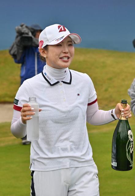 Yuri Yoshida of Japan celebrates her victory at the end of the final round of the LPGA Tour - BMW Ladies Championship golf tournament at Pine Beach Golf Links in Haenam on October 25, 2026. (Photo by Jung Yeon-je / AFP)