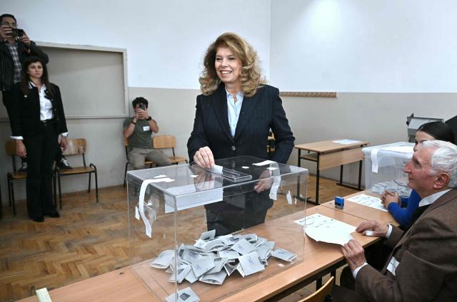 Bulgaria's incumbent President and Presidential candidate Iliana Iotova casts a ballot receipt to vote for the presidential election at a polling station in Sofia, on October 25, 2026. Bulgarians are voting in a presidential election on October 25, as security concerns swirl following a series of drone attacks on ships in the Black Sea. The incumbent President, who favors dialogue with Moscow and opposes military aid to Ukraine, is the frontrunner for a new term in the largely ceremonial post, polls show. (Photo by Nikolay DOYCHINOV / AFP)