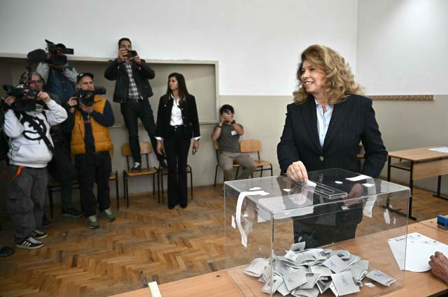 Bulgaria's incumbent President and Presidential candidate Iliana Iotova casts a ballot receipt to vote for the presidential election at a polling station in Sofia, on October 25, 2026. Bulgarians are voting in a presidential election on October 25, as security concerns swirl following a series of drone attacks on ships in the Black Sea. The incumbent President, who favors dialogue with Moscow and opposes military aid to Ukraine, is the frontrunner for a new term in the largely ceremonial post, polls show. (Photo by Nikolay DOYCHINOV / AFP)