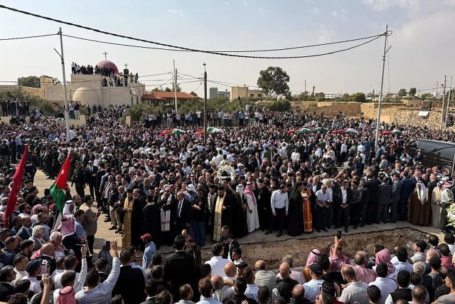 Mourners carry the bodies of those who were killed in the attack that took place two days earlier at the Greek Orthodox Church during their funeral in the village of Hammoud in Jordan's Karak governorate on October 25, 2026. Two people wounded in the October 23 attack on a church in southern Jordan have died of their injuries, bringing the number of people killed to nine, health minister Ibrahim al-Bdour told AFP on October 24. Another 25 people remain hospitalised, he added. (Photo by Ahmad SHOURA / AFP)