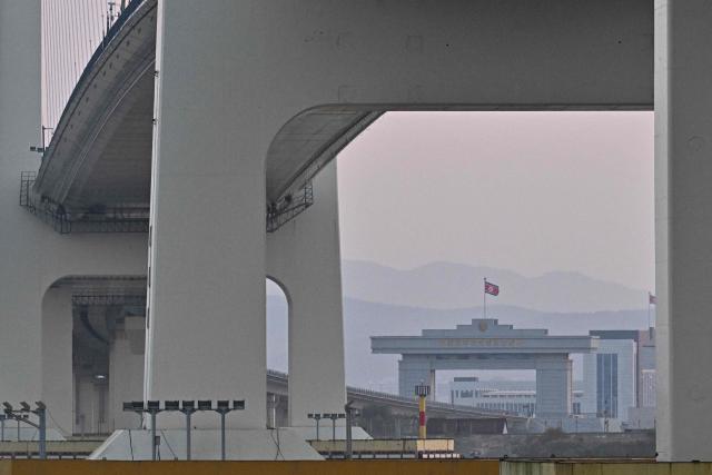 A general view shows the North Korean gate of a new cross-border bridge linking China and North Korea, as seen from Dandong, in northeastern China's Liaoning province, on October 25, 2026. North Korean leader Kim Jong Un returned home October 24 after a day-long trip to the Chinese border city of Dandong, Beijing's state media reported, though the purpose of the unannounced visit was not immediately clear. (Photo by Pedro PARDO / AFP)