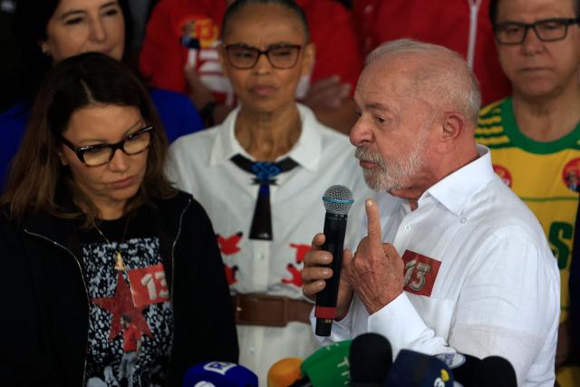 Brazil's President and re-election candidate for the Workers' Party (PT) Luiz Inacio Lula da Silva speaks alongside first lady Rosangela "Janja" da Silva, after casting his vote during the presidential runoff election, at a polling station in Sao Bernardo do Campo, state of Sao Paulo, Brazil, on October 25, 2026. Lula da Silva faces right-wing senator Flavio Bolsonaro in a runoff that will determine whether Brazil remains one of the few leftist nations in the region or joins a regional swing to the right championed by US President Donald Trump, Bolsonaro's ally. (Photo by Miguel SCHINCARIOL / AFP)