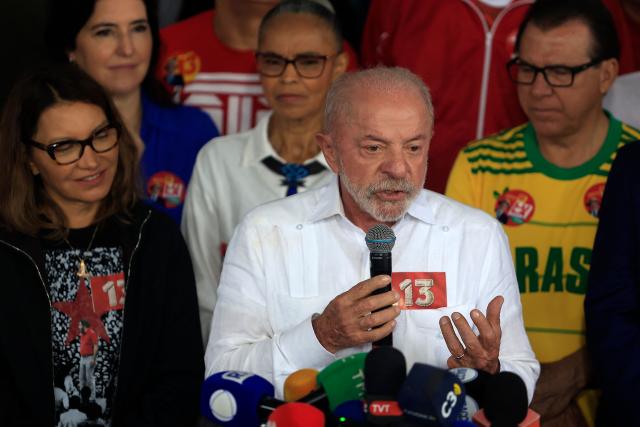 Brazil's President and re-election candidate for the Workers' Party (PT) Luiz Inacio Lula da Silva speaks alongside first lady Rosangela "Janja" da Silva, after casting his vote during the presidential runoff election, at a polling station in Sao Bernardo do Campo, state of Sao Paulo, Brazil, on October 25, 2026. Lula da Silva faces right-wing senator Flavio Bolsonaro in a runoff that will determine whether Brazil remains one of the few leftist nations in the region or joins a regional swing to the right championed by US President Donald Trump, Bolsonaro's ally. (Photo by Miguel SCHINCARIOL / AFP)