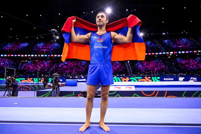 Armenia's Artur Davtyan celebrates after winning the Men's Vault Final during the 54th FIG Artistic Gymnastics World Championships, in Rotterdam, southern Netherlands, on October 25, 2026. (Photo by JOHN THYS / AFP)