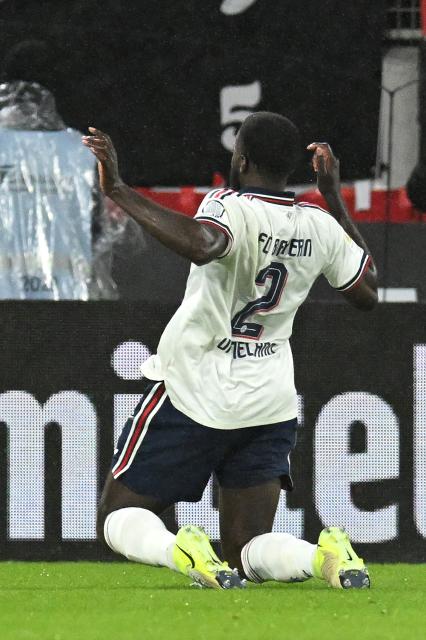 Bayern Munich's French defender #02 Dayot Upamecano (L) celebrates after scoring the opening goal 0-1 during the German first division Bundesliga football match between SC Freiburg and FC Bayern Munich in Freiburg, south-western Germany, on October 25, 2026. (Photo by THOMAS KIENZLE / AFP) / DFL REGULATIONS PROHIBIT ANY USE OF PHOTOGRAPHS AS IMAGE SEQUENCES AND/OR QUASI-VIDEO