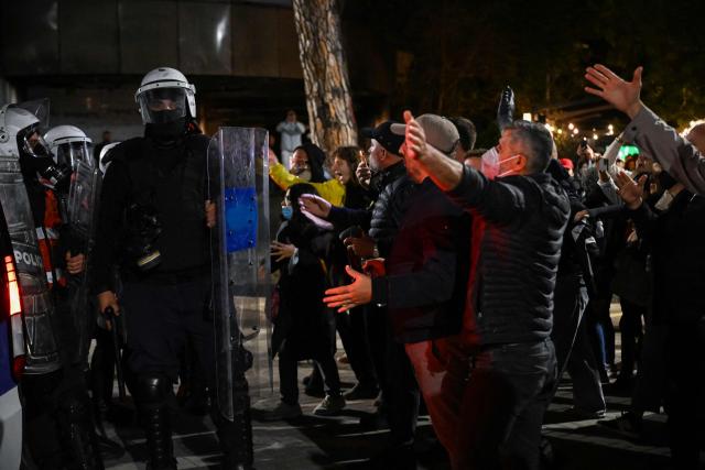 Protesters face riot police during an anti-government demonstration - called by the student-led protest movement to denounce poor study conditions and corruption and to demand prime minister's resignation, in central Tirana on October 25, 2026. (Photo by Armend NIMANI / AFP)