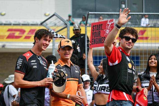 (L/R) Haas F1 Team's British driver Oliver Bearman, McLaren's British driver Lando Norris, and Ferrari's Monegasque driver Charles Leclerc arrive to take part in the drivers' parade before the start of the United States Formula One Grand Prix at the Circuit of the Americas in Austin, Texas, on October 25, 2026. (Photo by ANGELA WEISS / AFP)