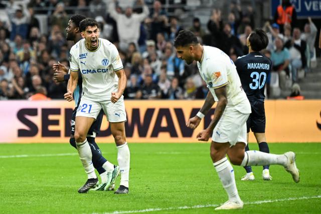 Marseille's defender #21 Nayef Aguerd celebrates after scoring during the French L1 football match between Olympique de Marseille (OM) and Havre Athletic Club (HAC) at the Stade Velodrome in Marseille, southern France, on October 25, 2026. (Photo by Justine Meddah / AFP)