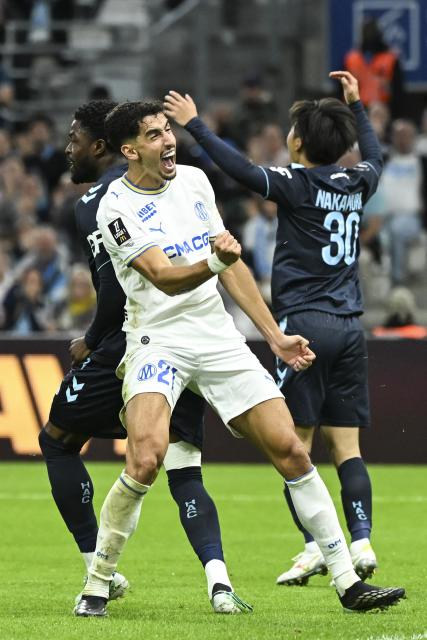 Marseille's defender #21 Nayef Aguerd celebrates after scoring during the French L1 football match between Olympique de Marseille (OM) and Havre Athletic Club (HAC) at the Stade Velodrome in Marseille, southern France, on October 25, 2026. (Photo by Justine Meddah / AFP)