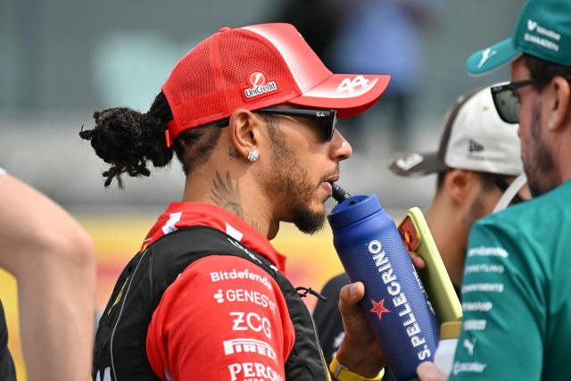 Ferrari's British driver Lewis Hamilton arrives to take part in the drivers' parade before the start of the United States Formula One Grand Prix at the Circuit of the Americas in Austin, Texas, on October 25, 2026. (Photo by ANGELA WEISS / AFP)