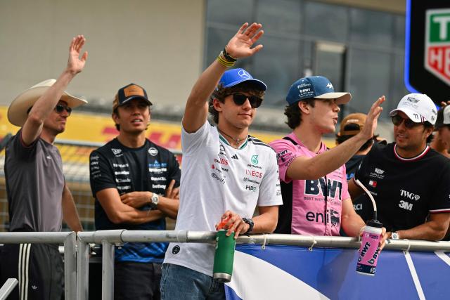 (L/R) Audi's German driver Nico Hulkenberg, Williams' Thai driver Alexander Albon, Mercedes' Italian driver Kimi Antonelli, Alpine's Argentine driver Franco Colapinto, and Cadillac's Mexican driver Sergio Perez take part in the drivers' parade before the start of the United States Formula One Grand Prix at the Circuit of the Americas in Austin, Texas, on October 25, 2026. (Photo by ANGELA WEISS / AFP)