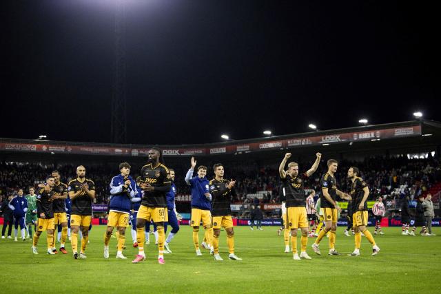Ajax's players acknowledge the fans as they celebrate their team's victory at the end of the Dutch Eredivisie football match between Sparta Rotterdam and Ajax Amsterdam at Sparta-Stadion Het Kasteel in Rotterdam on October 25, 2026. (Photo by Sonny Lensen / ANP / AFP) / Netherlands OUT