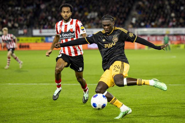 Ajax's Belgian midfielder #24 Jorthy Mokio (R) kicks the ball during the Dutch Eredivisie football match between Sparta Rotterdam and Ajax Amsterdam at Sparta-Stadion Het Kasteel in Rotterdam on October 25, 2026. (Photo by Sonny Lensen / ANP / AFP) / Netherlands OUT