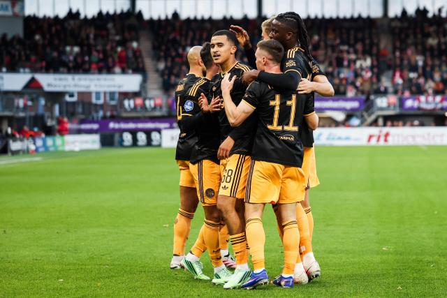 Ajax's Moroccan midfielder #68 Abdellah Ouazane (C) celebrates with teammates after scoring Ajax's first goal during the Dutch Eredivisie football match between Sparta Rotterdam and Ajax Amsterdam at Sparta-Stadion Het Kasteel in Rotterdam on October 25, 2026. (Photo by Sonny Lensen / ANP / AFP) / Netherlands OUT