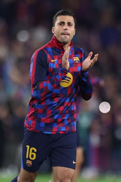 Barcelona's Spanish midfielder #16 Rodrigo warms up before the Spanish league football match between FC Barcelona and Real Madrid CF at Camp Nou Stadium in Barcelona on October 25, 2026. (Photo by Josep LAGO / AFP)
