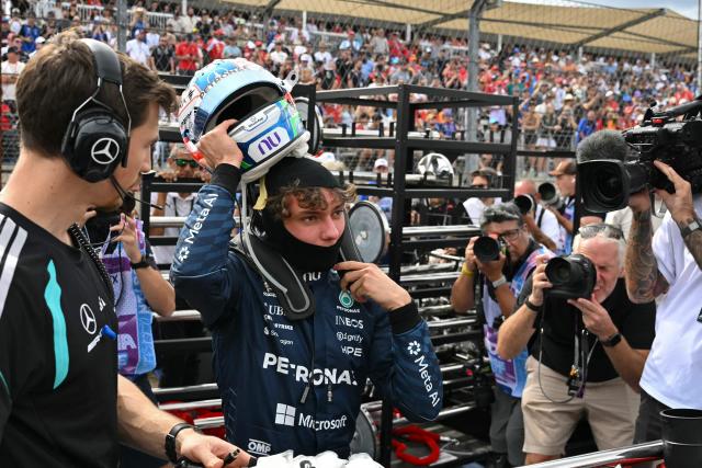 Mercedes' Italian driver Kimi Antonelli prepares to get into his car on the starting grid before the start of the United States Formula One Grand Prix at the Circuit of the Americas in Austin, Texas, on October 25, 2026. (Photo by ANGELA WEISS / AFP)