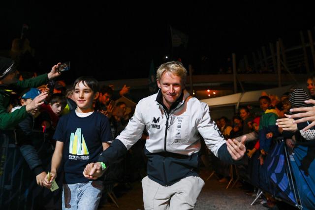 "NC" IMOCA Class French sailor Maxime Sorel arrives to attend the skippers official presentation in the harbour of Saint-Malo, on October 25, 2026, a few days before the start of the 13th Route du Rhum - Destination Guadeloupe. From Saint-Malo in Brittany to Pointe-à-Pitre in Guadeloupe, 115 skippers across 6 classes will take the start on November 1, 2026, in this solo transatlantic sailing race. (Photo by Sebastien Salom-Gomis / AFP)