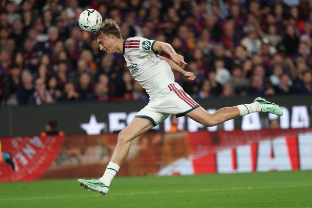Real Madrid's Spanish defender #04 Dean Huijsen heads the ball during the Spanish league football match between FC Barcelona and Real Madrid CF at Camp Nou Stadium in Barcelona on October 25, 2026. (Photo by Lluis GENE / AFP)