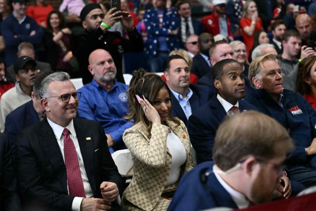 US rapper Nicki Minaj reacts as President Donald Trump speaks during a campaign rally at the McMorran Place Sports & Entertainment Center in Port Huron, Michigan, on October 25, 2026. (Photo by Brendan SMIALOWSKI / AFP)