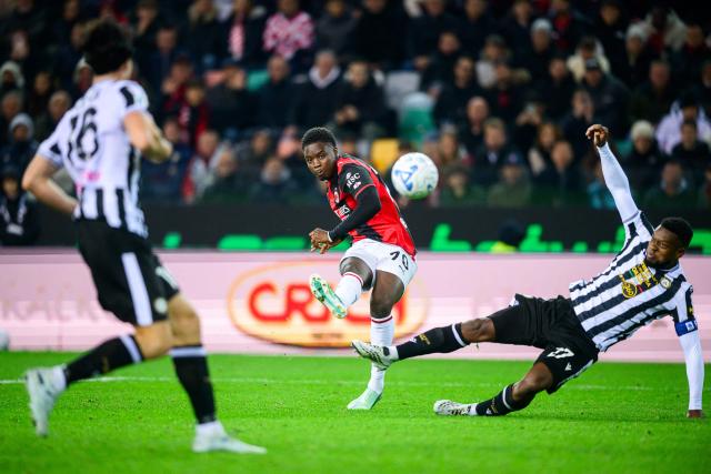 AC Milan's Italian midfielder #70 Alphadjo Cisse kicks the ball next to Udinese's Belgian defender #27 Christian Kabasele during the Italian Serie A football match between Udinese and Milan at the Stadio Friuli in Udine on October 25, 2026. (Photo by Jure Makovec / AFP)