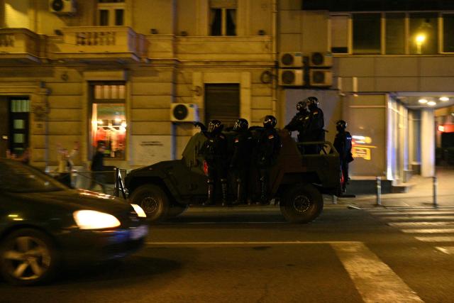 Serbian police travel through downtown Belgrade as supporters of the Students’ List celebrate their victory in the Serbian parliamentary elections, in Belgrade on October 25, 2026. Voters cast ballots in record numbers on October 25, 2026, with the country recording its highest parliamentary election turnout in more than three decades. Celebrations erupted on the streets of the capital; passing cars honked their horns as crowds began to party at the news that Serbia's ruling party had lost parliamentary snap elections. (Photo by Andrej ISAKOVIC / AFP)