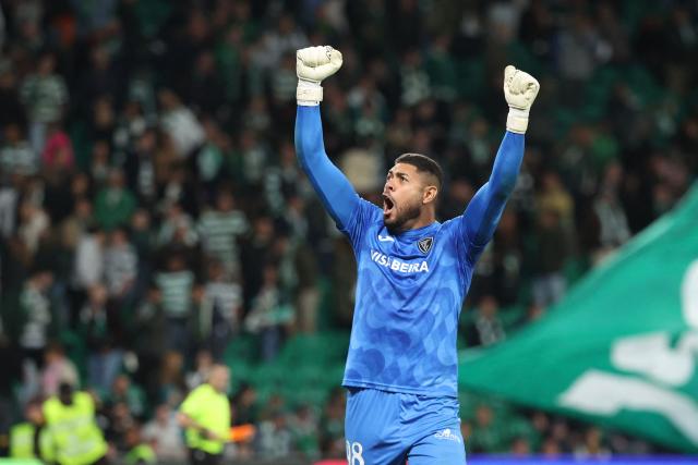 Academico de Viseu's Brazilian goalkeeper #98 Ewerton celebrates at the end of the Portuguese League football match between Sporting CP and Academico de Viseu FC at Jose Alvalade stadium in Lisbon on October 25, 2026. Academico won 1-2. (Photo by PATRICIA DE MELO MOREIRA / AFP)