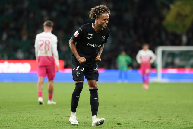 Academico de Viseu's Portuguese defender #75 Ricardo Ribeiro Vieira "Robinho" celebrates at the end of the Portuguese League football match between Sporting CP and Academico de Viseu FC at Jose Alvalade stadium in Lisbon on October 25, 2026. Academico won 1-2. (Photo by PATRICIA DE MELO MOREIRA / AFP)