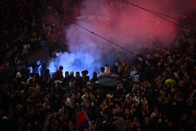 Supporters of the Students’ List celebrate their victory in the Serbian parliamentary elections, in downtown Belgrade on October 25, 2026. Voters cast ballots in record numbers on October 25, 2026, with the country recording its highest parliamentary election turnout in more than three decades. Celebrations erupted on the streets of the capital; passing cars honked their horns as crowds began to party at the news that Serbia's ruling party had lost parliamentary snap elections. (Photo by OLIVER BUNIC / AFP)
