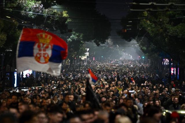 Supporters of the Students’ List gather in downtown Belgrade to celebrate their victory in the Serbian parliamentary elections, in Belgrade on October 25, 2026. Voters cast ballots in record numbers on October 25, 2026, with the country recording its highest parliamentary election turnout in more than three decades. Celebrations erupted on the streets of the capital; passing cars honked their horns as crowds began to party at the news that Serbia's ruling party had lost parliamentary snap elections. (Photo by OLIVER BUNIC / AFP)