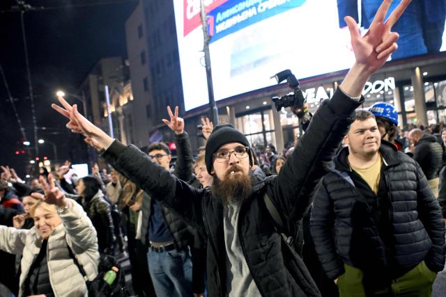 Supporters of the Students’ List gather to celebrate their victory in the Serbian parliamentary elections, in downtown Belgrade on October 25, 2026. Voters cast ballots in record numbers on October 25, 2026, with the country recording its highest parliamentary election turnout in more than three decades. Celebrations erupted on the streets of the capital; passing cars honked their horns as crowds began to party at the news that Serbia's ruling party had lost parliamentary snap elections. (Photo by MARKO LJUTICA / AFP)