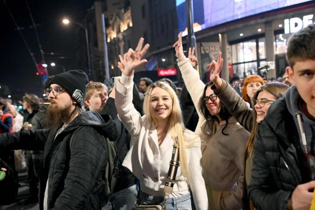 Supporters of the Students’ List gather to celebrate their victory in the Serbian parliamentary elections, in downtown Belgrade on October 25, 2026. Voters cast ballots in record numbers on October 25, 2026, with the country recording its highest parliamentary election turnout in more than three decades. Celebrations erupted on the streets of the capital; passing cars honked their horns as crowds began to party at the news that Serbia's ruling party had lost parliamentary snap elections. (Photo by MARKO LJUTICA / AFP)