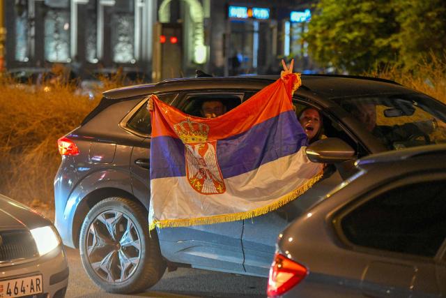Citizens of Northern-Serbian city of Novi Sad celebrate in the streets after students movement declared victory of their candidates list at snap Parliamentary elections, on October 25, 2026. Voters cast ballots in record numbers on October 25, 2026, with the country recording its highest parliamentary election turnout in more than three decades. Celebrations erupted on the streets of the capital; passing cars honked their horns as crowds began to party at the news that Serbia's ruling party had lost parliamentary snap elections. (Photo by NENAD MIHAJLOVIC / AFP)