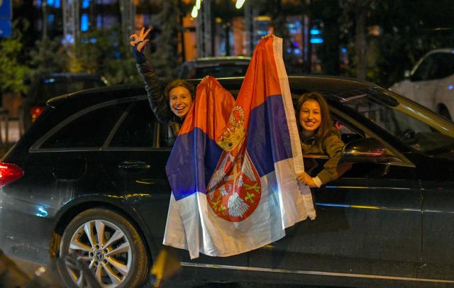 Citizens of Northern-Serbian city of Novi Sad celebrate in the streets after students movement declared victory of their candidates list at snap Parliamentary elections, on October 25, 2026. Voters cast ballots in record numbers on October 25, 2026, with the country recording its highest parliamentary election turnout in more than three decades. Celebrations erupted on the streets of the capital; passing cars honked their horns as crowds began to party at the news that Serbia's ruling party had lost parliamentary snap elections. (Photo by NENAD MIHAJLOVIC / AFP)