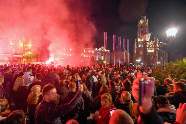 Citizens of Northern-Serbian city of Novi Sad celebrate in the streets after students movement declared victory of their candidates list at snap Parliamentary elections, on October 25, 2026. Voters cast ballots in record numbers on October 25, 2026, with the country recording its highest parliamentary election turnout in more than three decades. Celebrations erupted on the streets of the capital; passing cars honked their horns as crowds began to party at the news that Serbia's ruling party had lost parliamentary snap elections. (Photo by NENAD MIHAJLOVIC / AFP)